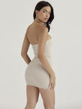 Get Ready to Steal the Spotlight with our Beige Hollow Out Flower Sexy Mini Dress